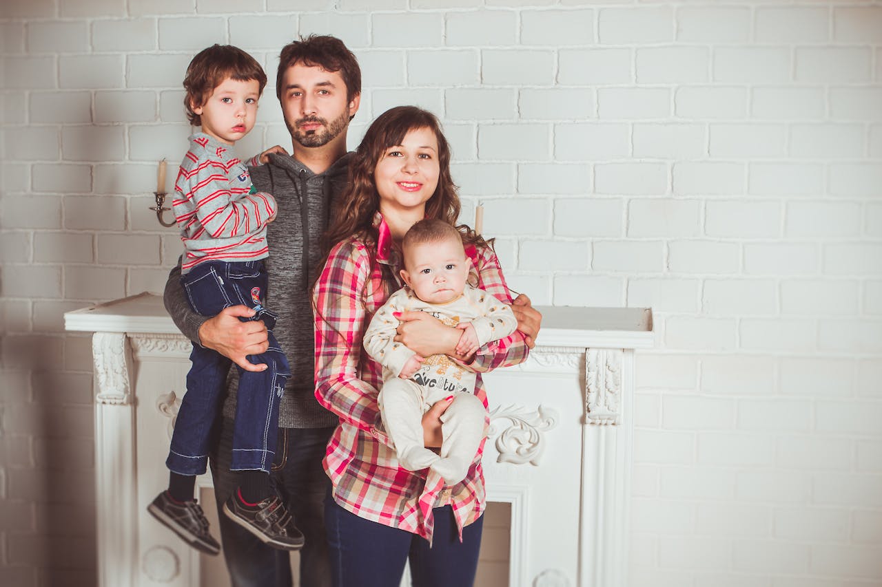 Standing Family Near Fireplace